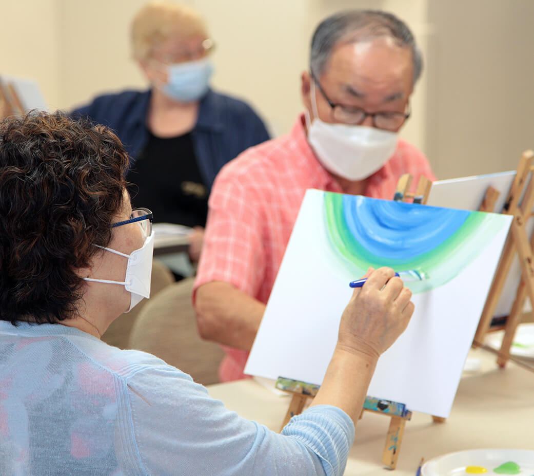 Affordable housing community residents painting